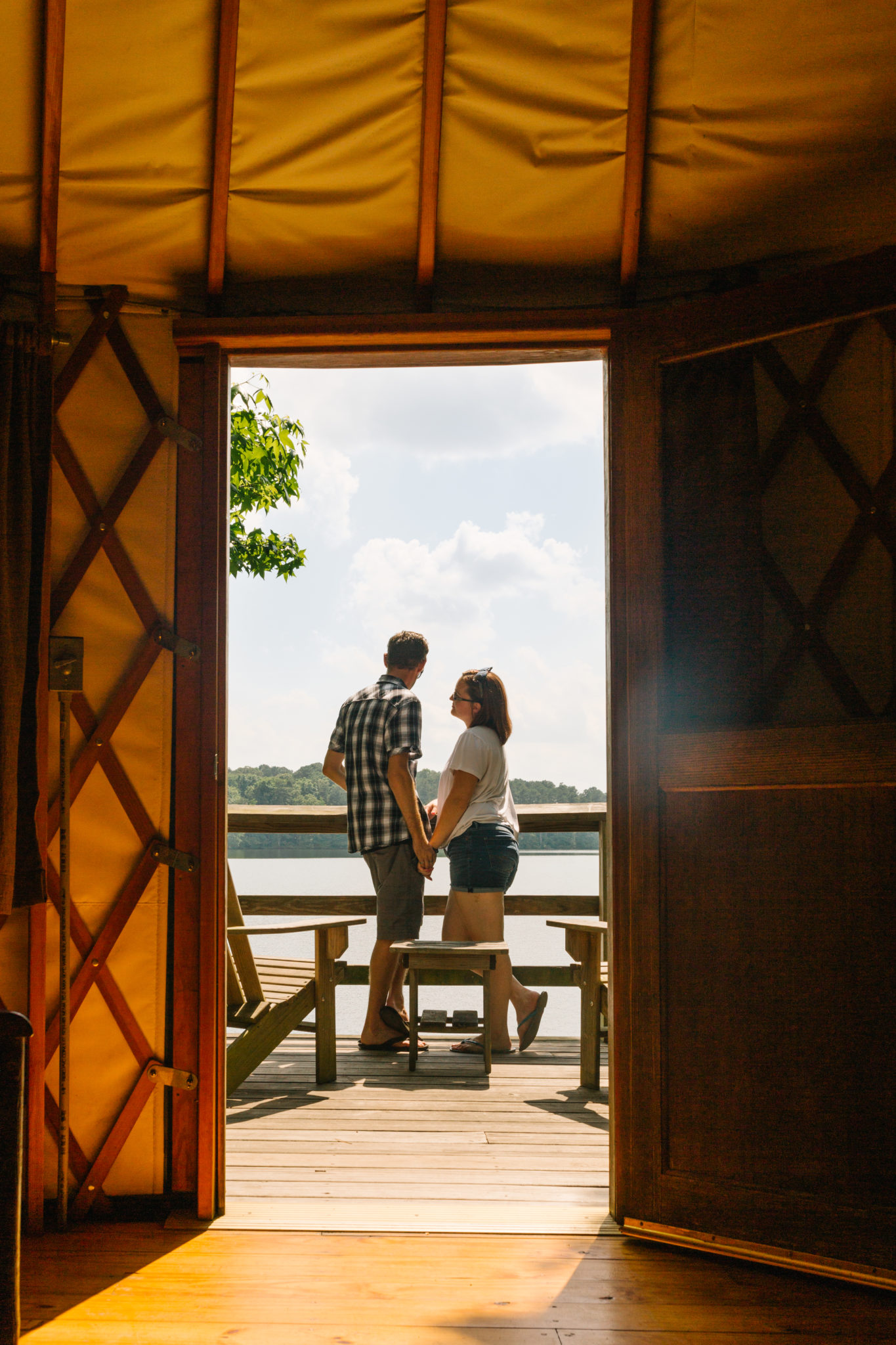 a couple on the porch of a yurt in Fort Yargo