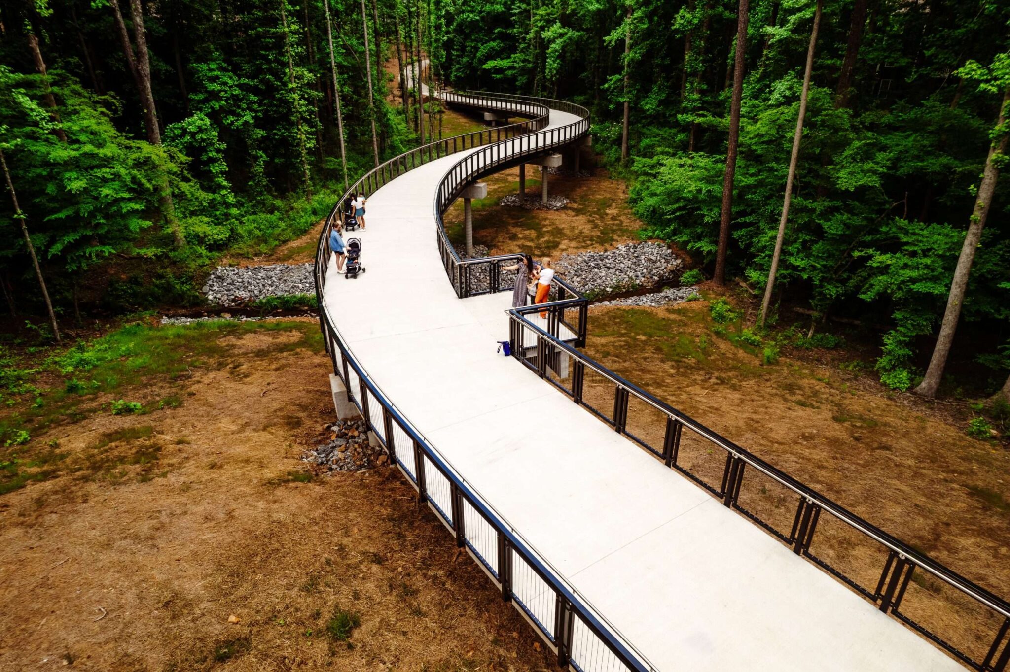 Alpha Loop multi-use trail winding past brick townhomes near Downtown Alpharetta, GA