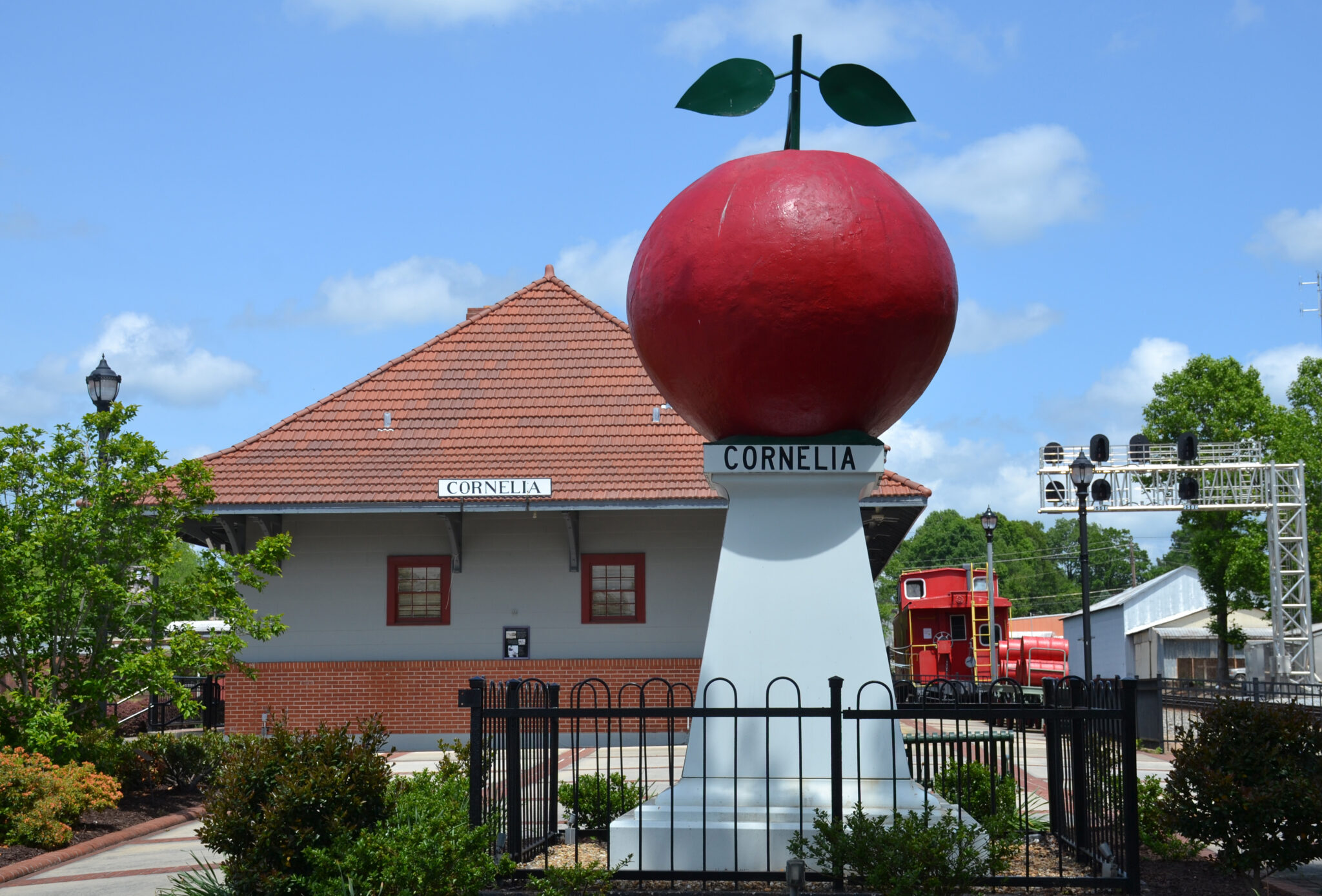 Cornelia train depot and big red apple