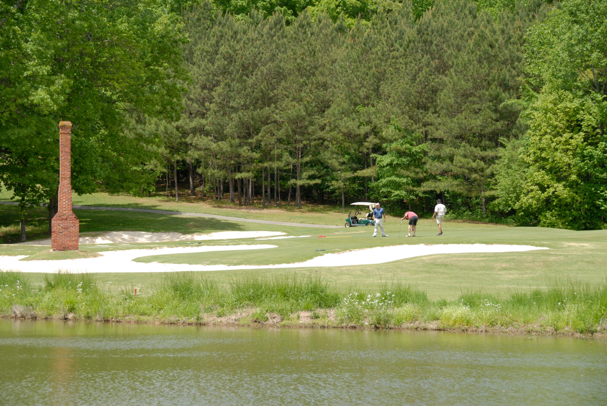 Golfers playing the Fields Ferry Course