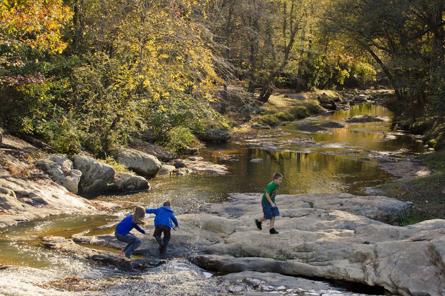 Kids playing on sliding rocks